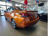 Thumbnail of 2021 Monarch Orange Pearl Met Nissan Versa