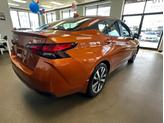Thumbnail of 2021 Monarch Orange Pearl Met Nissan Versa