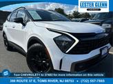 Photo of 2023 Glacier White Pearl/Ebony Black Roof Kia Sportage