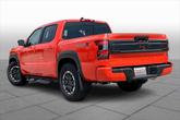 Thumbnail of 2025 Afterburn Orange Nissan Frontier