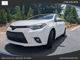 Photo of 2016 Super White Toyota Corolla