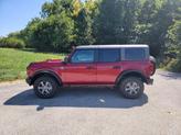 Thumbnail of 2025 Ruby Red Metallic Tinted Clearcoat Ford Bronco