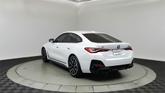 Thumbnail of 2024 Mineral White Metallic BMW i4 Gran Coupe