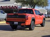 Thumbnail of 2025 Afterburn Orange Nissan Frontier