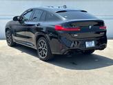 Thumbnail of 2024 Black Sapphire Metallic BMW X4