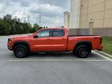 Thumbnail of 2025 Afterburn Orange Nissan Frontier