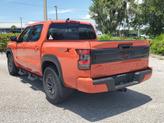 Thumbnail of 2025 Afterburn Orange Nissan Frontier