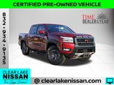 Photo of 2025 Cardinal Red Metallic Nissan Frontier