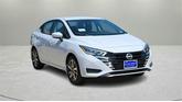 Photo of 2025 Aspen White Tricoat Nissan Versa