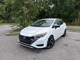 Photo of 2024 Aspen White Tricoat Nissan Versa