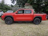 Thumbnail of 2025 Afterburn Orang Nissan Frontier