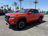 Thumbnail of 2025 Afterburn Orange Nissan Frontier