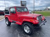 Photo of 1989 Red Jeep Wrangler