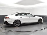 Thumbnail of 2026 Mineral White Metallic BMW 550e