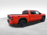 Thumbnail of 2025 Afterburn Orange Nissan Frontier