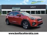 Photo of 2022 Solar Orange Kia Niro