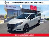 Photo of 2025 Aspen White Tricoat Nissan Versa