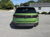 Thumbnail of 2025 Bright Moss Green Metallic/Deep Black Roof Volkswagen Taos