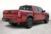 Thumbnail of 2024 Cardinal Red Metallic Nissan Frontier