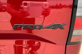 Thumbnail of 2024 Cardinal Red Metallic Nissan Frontier