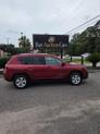 Thumbnail of 2015 Deep Cherry Red Crystal Pearlcoat Jeep Compass