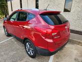 Thumbnail of 2015 Garnet Red Mica Hyundai TUCSON