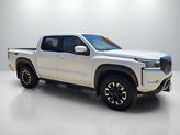Thumbnail of 2024 Glacier White Nissan Frontier