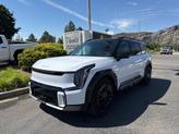 Photo of 2026 Glacier White Pearl/Ebony Black Roof Kia EV9