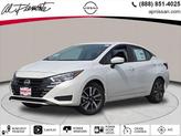 Photo of 2025 Aspen White Tricoat Nissan Versa