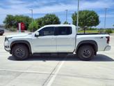 Thumbnail of 2025 Glacier White Nissan Frontier