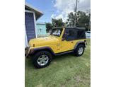 Photo of 2000 Yellow Jeep Wrangler