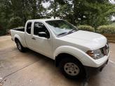 Photo of 2013 White Nissan Frontier