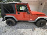 Thumbnail of 2006 Orange Jeep Wrangler