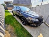 Photo of 2010 Black Ford Taurus
