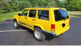 Thumbnail of 2001 Yellow Jeep Cherokee