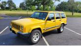 Thumbnail of 2001 Yellow Jeep Cherokee