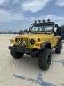 Thumbnail of 2002 Yellow Jeep Wrangler
