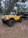 Photo of 2002 Yellow Jeep Wrangler