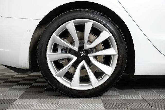 Photo of 2018 Pearl White Multi Tesla Model 3