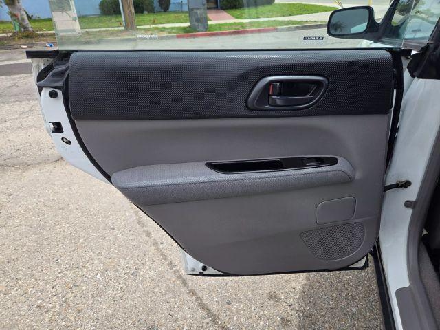Photo of 2004 Aspen White / Textured Gray Subaru Forester