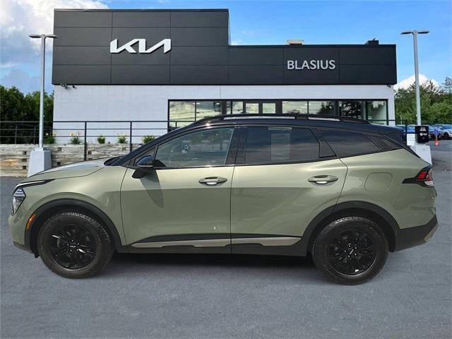 Photo of 2023 Jungle Green/Ebony Black Roof Kia Sportage