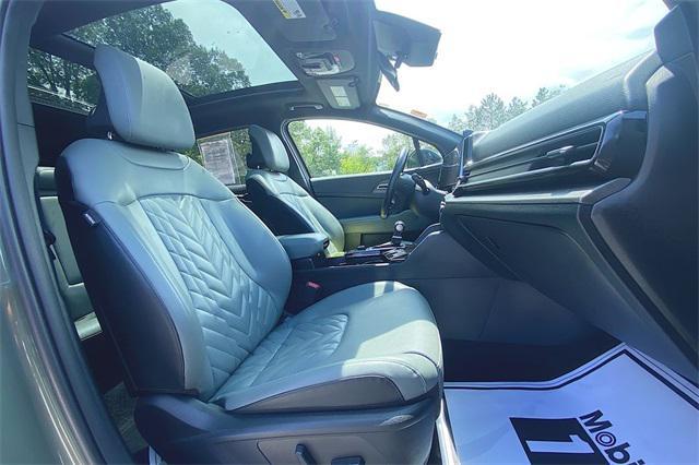 Photo of 2023 Jungle Green/Ebony Black Roof Kia Sportage