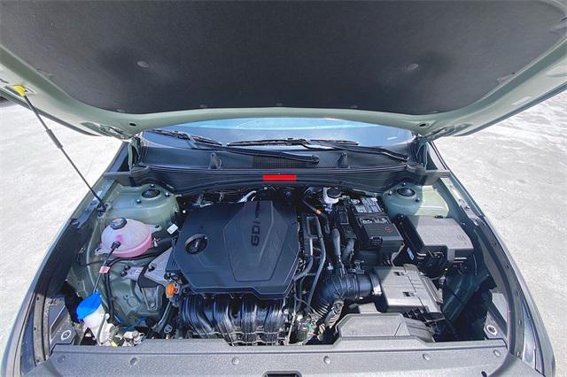 Photo of 2023 Jungle Green/Ebony Black Roof Kia Sportage