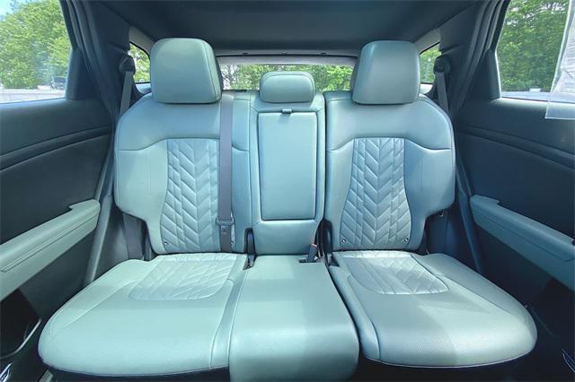Photo of 2023 Jungle Green/Ebony Black Roof Kia Sportage