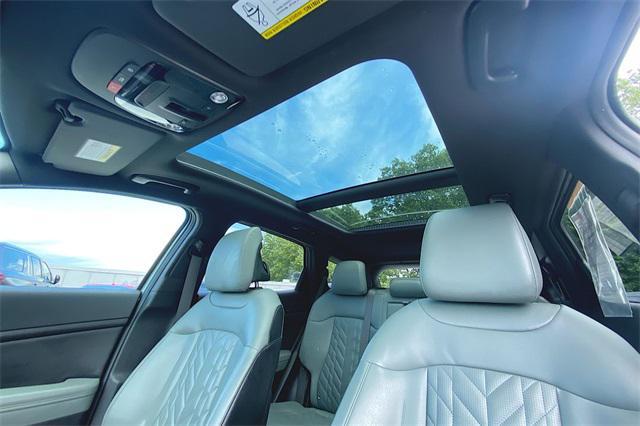 Photo of 2023 Jungle Green/Ebony Black Roof Kia Sportage
