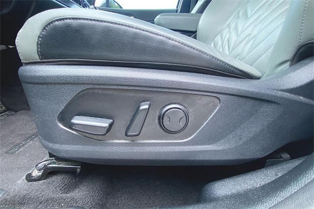 Photo of 2023 Jungle Green/Ebony Black Roof Kia Sportage