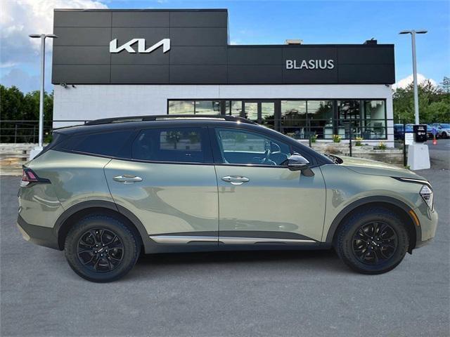 Photo of 2023 Jungle Green/Ebony Black Roof Kia Sportage