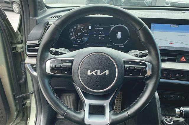 Photo of 2023 Jungle Green/Ebony Black Roof Kia Sportage