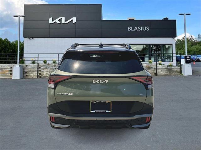 Photo of 2023 Jungle Green/Ebony Black Roof Kia Sportage