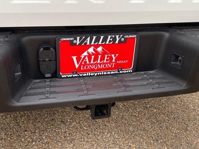 Photo of 2025 Glacier White Nissan Frontier